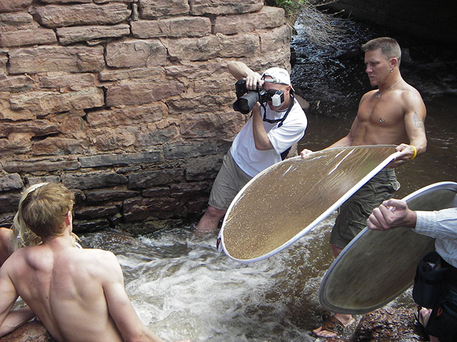 Brody Hall photographing two models in Colorado stream