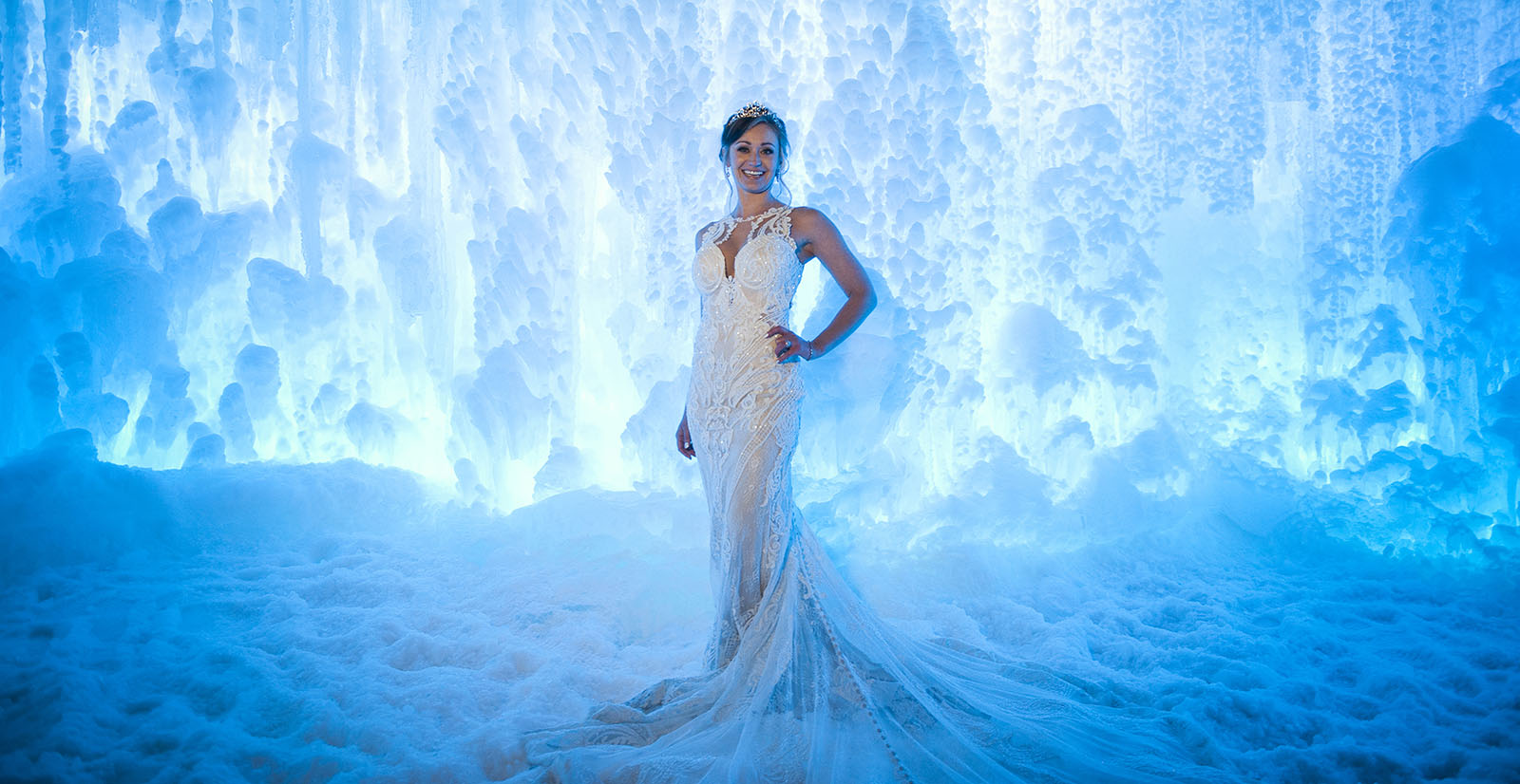 Beautiful bride in wedding gown in the Ice Castles at night, in Dillon, CO