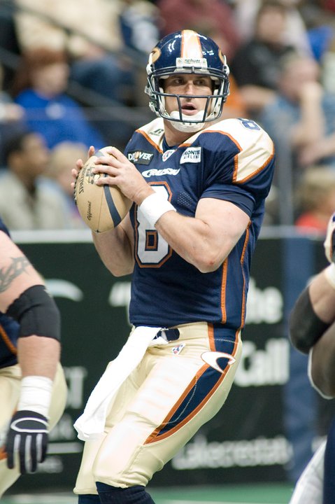 Arena football quarterback getting ready for a pass