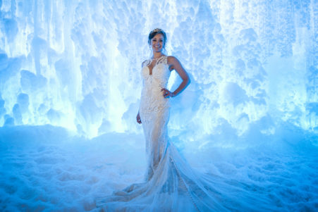 Bride standing in front of the Ice Castles in Dillon Colorado