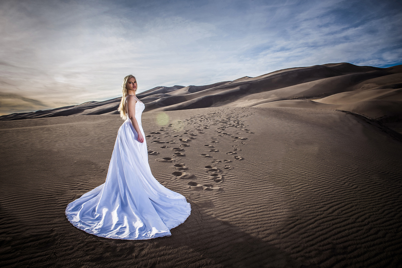 Sky in wedding dress at Great Sand Dunes