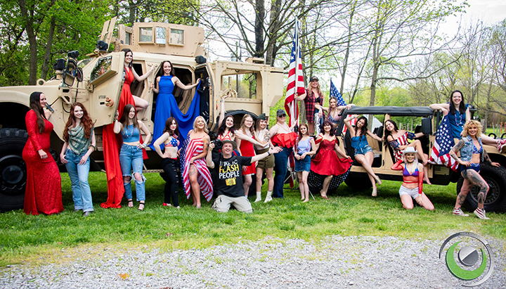 An Army truck and Humvee with 20 models and myself. Taken at a group shoot at Sinking Creek Farm