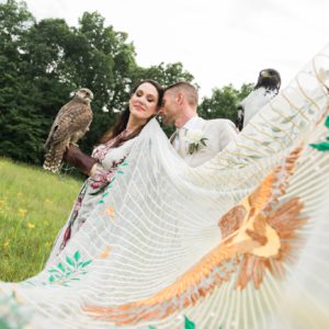 Bride and Groom posing with Falcons