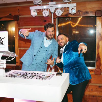 DJ Jonny Mack working a wedding from behind his turntable