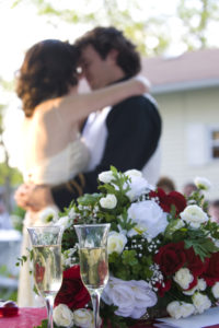bride and groom in Chicago, having their first dance with glasses of champagne