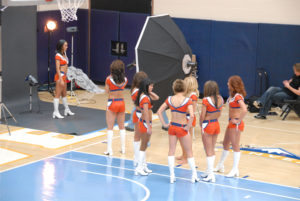 Denver Professional cheerleaders watching the photo shoot and waiting their turn