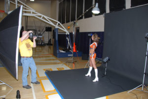 Taking a photo of a Denver Cheerleader in a training gym with a portable studio set-up.