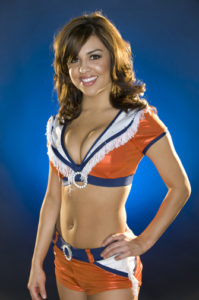 Professional Colorado Cheerleader headshot photographed in Denver practice gym.