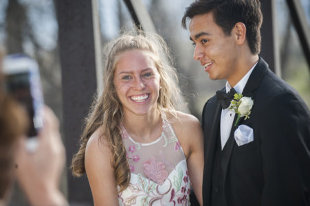 A prom couple taking photos outside at a park in Nashville