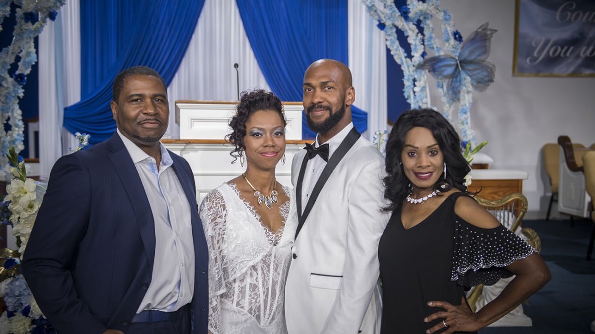 Father and daughter with their spouses at her wedding, photographed by Brody Hall Photography.