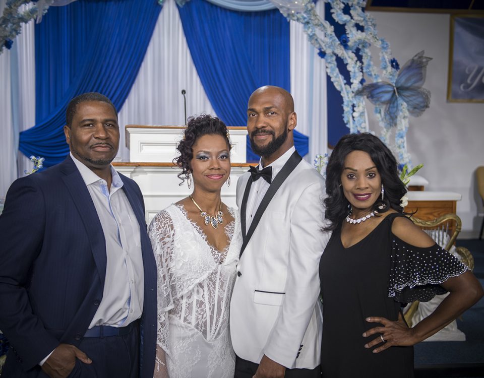 Father and daughter with their spouses at her wedding, photographed by Brody Hall Photography.